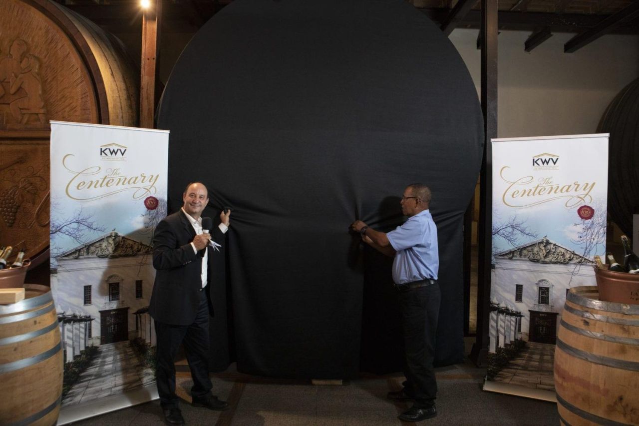 Boyce Lloyd and Billy August unveil the newly carved vat