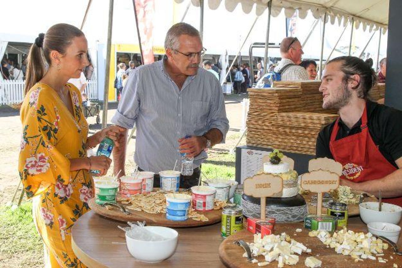 Landi Ehlers and Johan Ehlers Agri Expo CEO tasting cheese at President Cheese stand