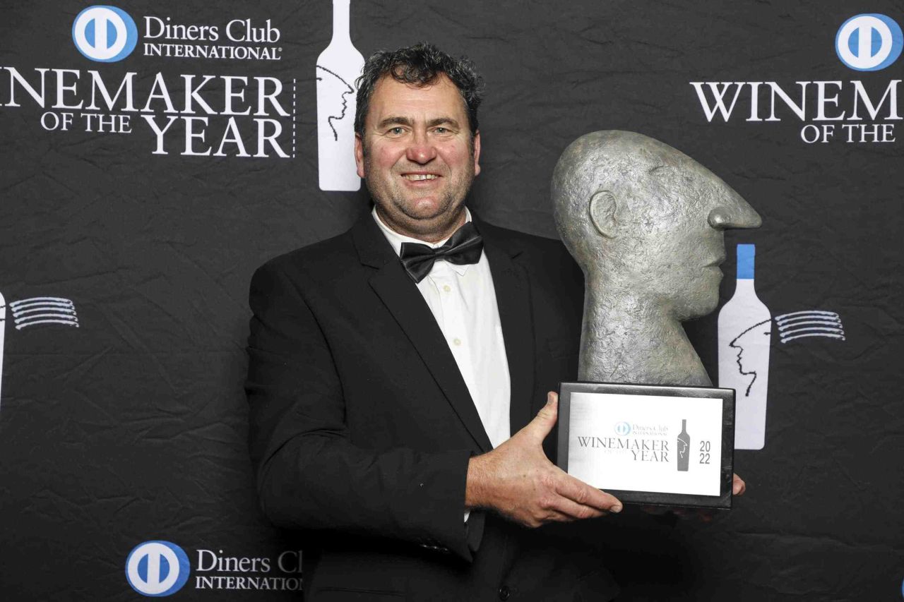 Conrad Vlok Strandveld Wines with his 2022 Diners Club Winemaker of the Year Trophy