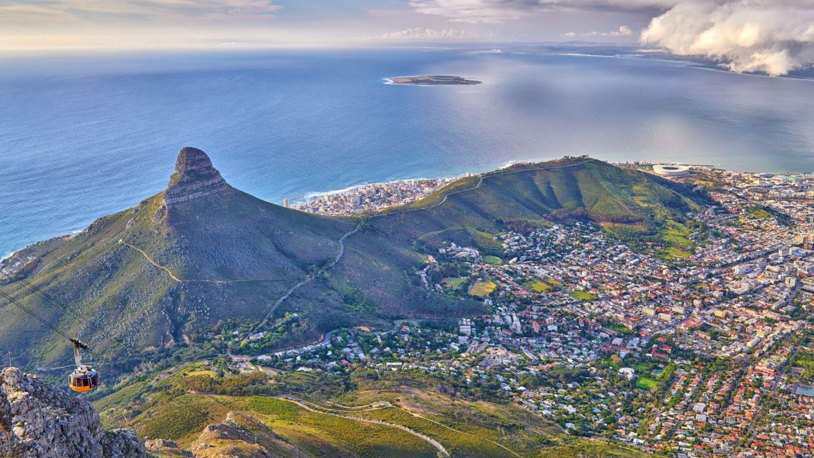 Aerial view lions head mountain with ocean cloudy sky copy space beautiful landscape green mountains with vegetation surrounding urban city cape town south africa