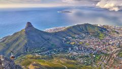 Aerial view lions head mountain with ocean cloudy sky copy space beautiful landscape green mountains with vegetation surrounding urban city cape town south africa